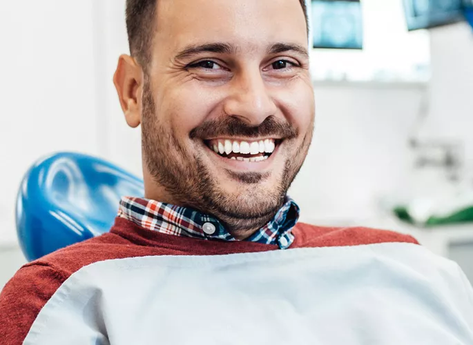 Man smiling in dental chair